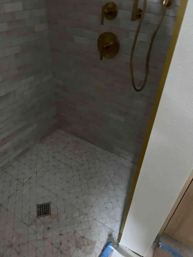Walk-in tile shower with brushed gold rain head and handheld fixtures in Boring OR – Efficiency Plumbing