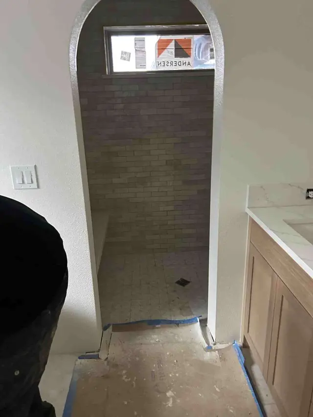 Bathroom mirror reflecting custom zellige tile shower with built-in niche in Sandy OR – Efficiency Plumbing