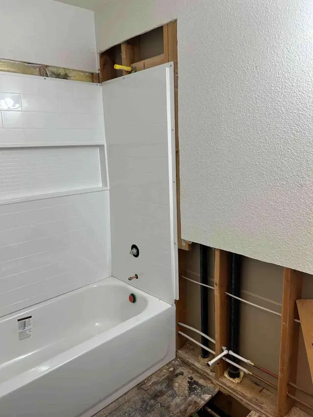 Bathtub and shower surround installation with white tile in Clackamas OR – Efficiency Plumbing