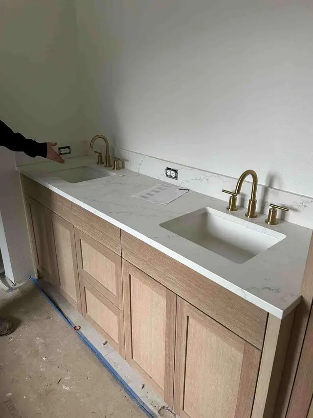Double bathroom vanity with brushed gold faucets and quartz countertop in Sandy OR – Efficiency Plumbing