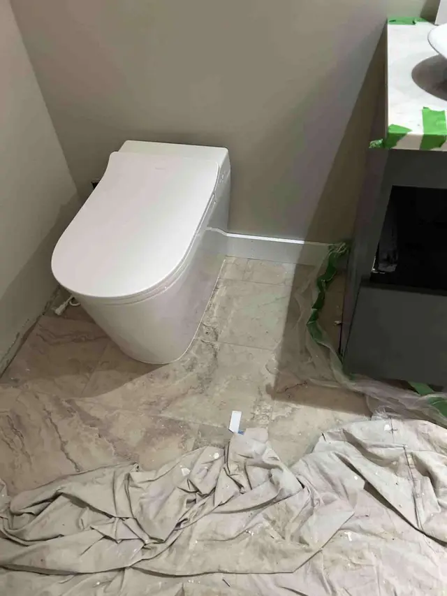 Wall-hung toilet installation with marble tile flooring in Oregon City OR – Efficiency Plumbing